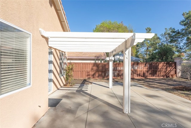 view of patio / terrace with a fenced backyard and a pergola