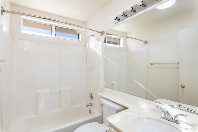 bathroom featuring toilet, shower / tub combination, and vanity