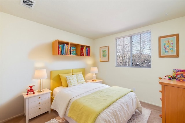 bedroom featuring visible vents, light carpet, and baseboards