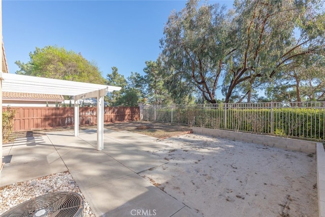 view of patio / terrace with a fenced backyard and a pergola