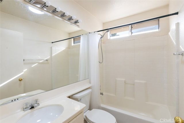 bathroom featuring shower / bath combo, vanity, and toilet