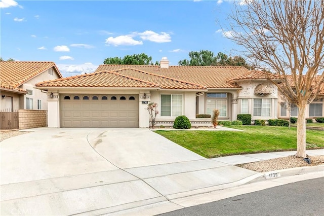 mediterranean / spanish-style house with a garage and a front yard