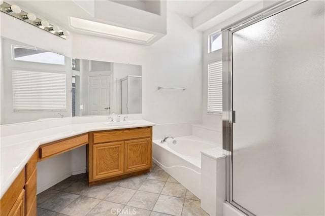 bathroom featuring vanity, tile patterned flooring, and plus walk in shower