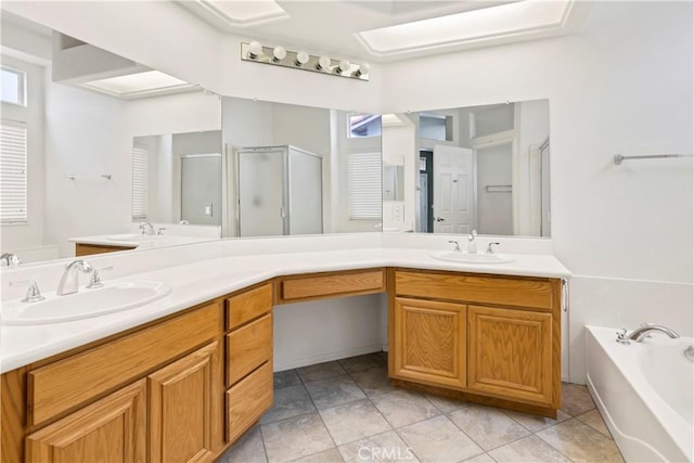 bathroom featuring a healthy amount of sunlight, vanity, tile patterned flooring, and separate shower and tub