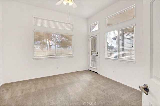 interior space with ceiling fan