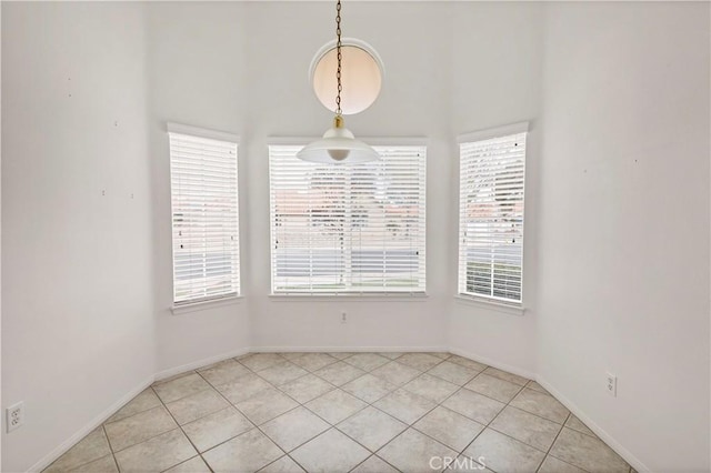 spare room with light tile patterned floors