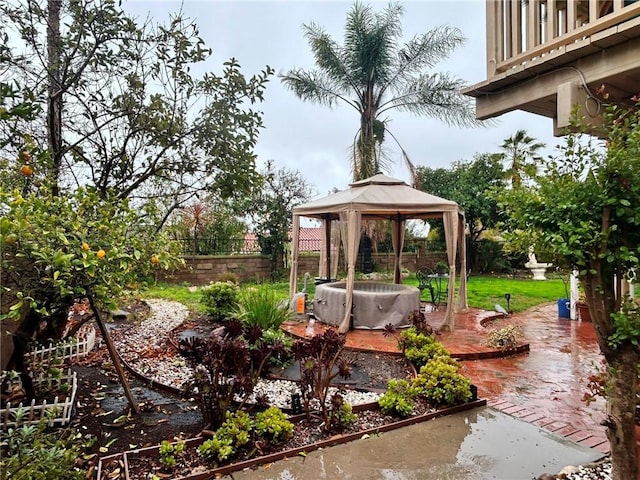 view of yard featuring a gazebo, a balcony, and a patio area