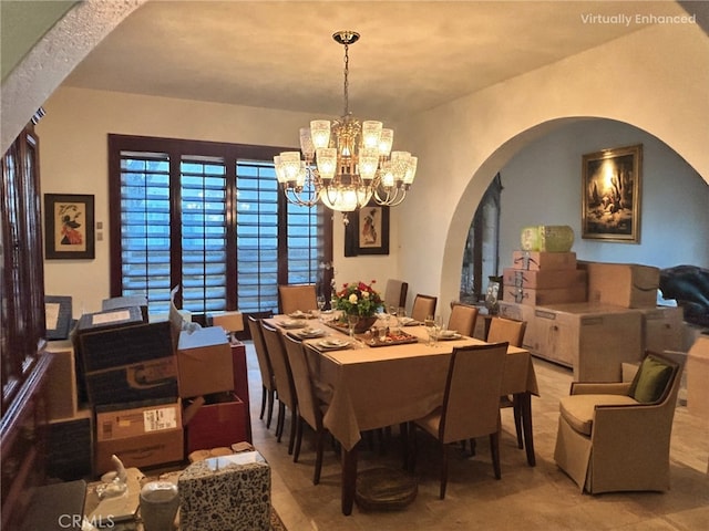 dining area featuring an inviting chandelier