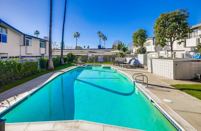 view of swimming pool with a patio