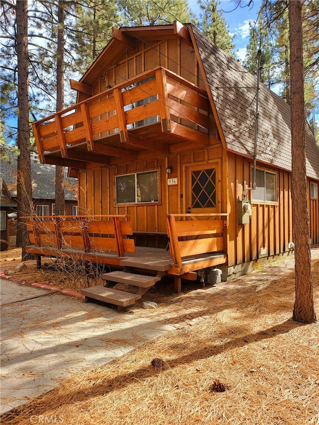 view of front facade with a wooden deck