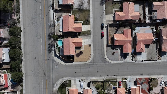 birds eye view of property with a residential view