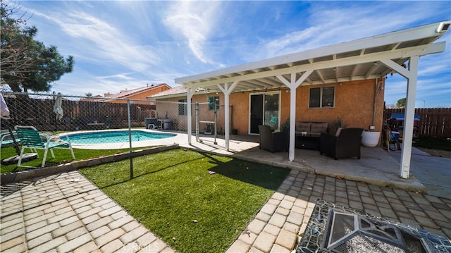 exterior space with fence, an outdoor hangout area, a patio area, and a fenced in pool