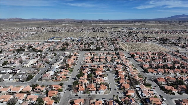 drone / aerial view with a mountain view and a residential view