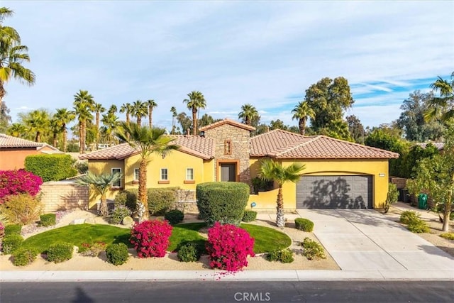 mediterranean / spanish-style house featuring a garage