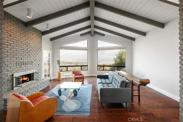 living room featuring a brick fireplace, vaulted ceiling with beams, and dark hardwood / wood-style floors