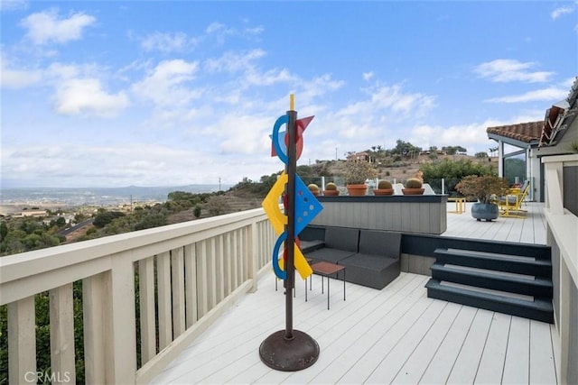 wooden deck with an outdoor hangout area