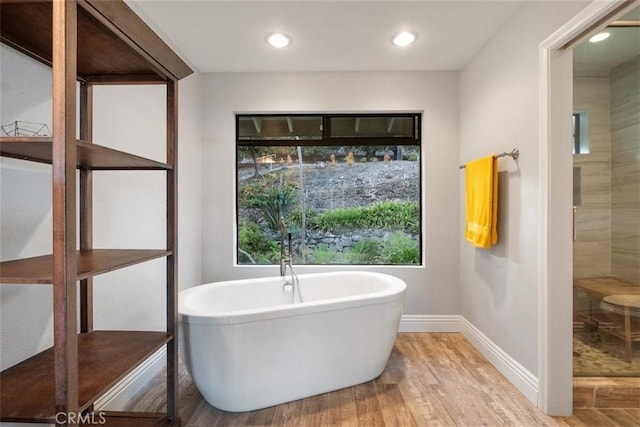 bathroom featuring a bathing tub and hardwood / wood-style floors