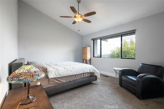 carpeted bedroom with vaulted ceiling and ceiling fan