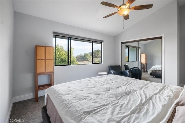 bedroom featuring a closet, vaulted ceiling, carpet flooring, and ceiling fan