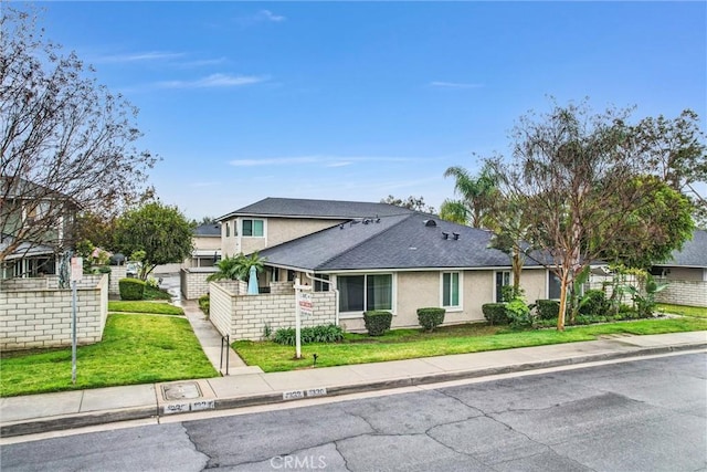 view of front of home with a front lawn