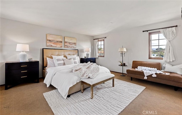 carpeted bedroom featuring baseboards