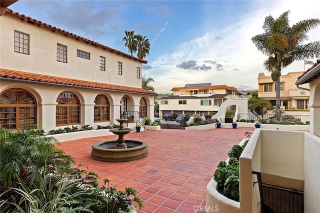 view of patio featuring a grill and fence