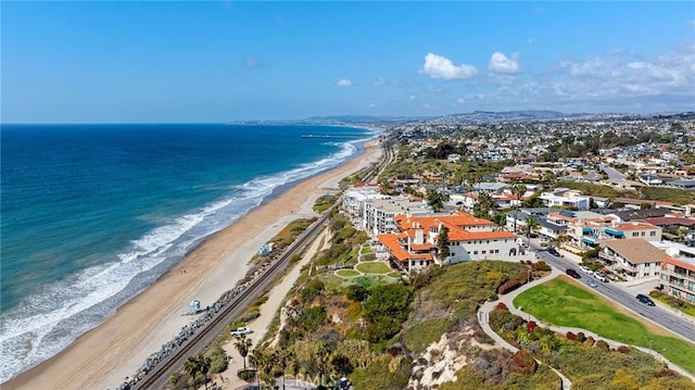 bird's eye view featuring a water view and a view of the beach