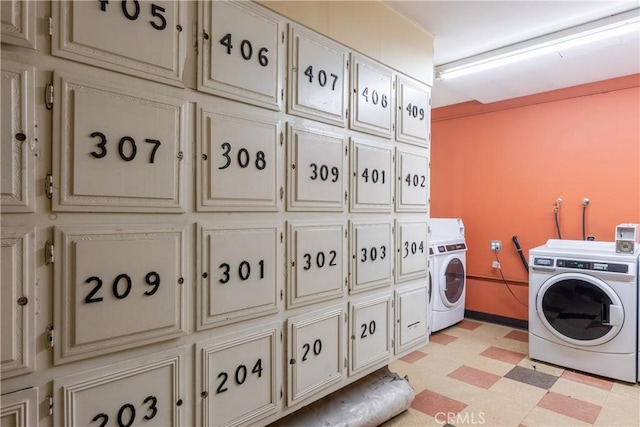 washroom with cabinets and washer / dryer