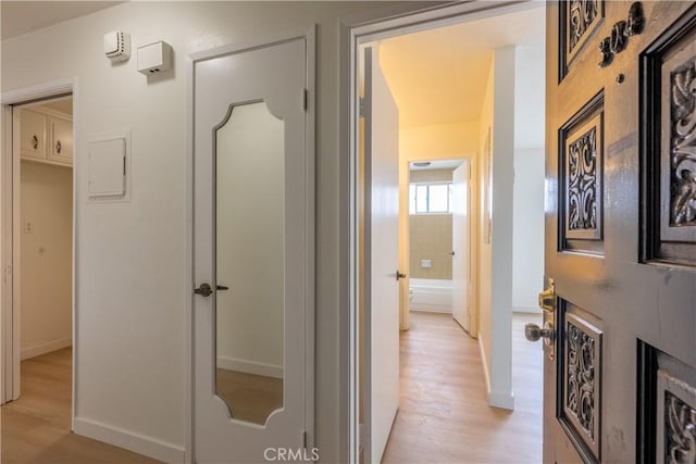 hall with light hardwood / wood-style flooring