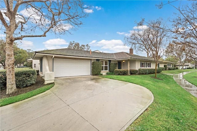 ranch-style house featuring a garage and a front lawn