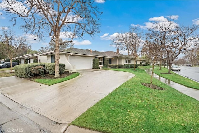 single story home with a garage and a front lawn