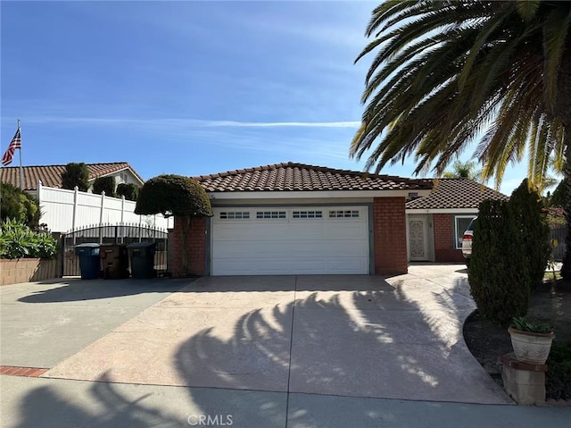 view of front of home featuring brick siding, an attached garage, a tile roof, and driveway