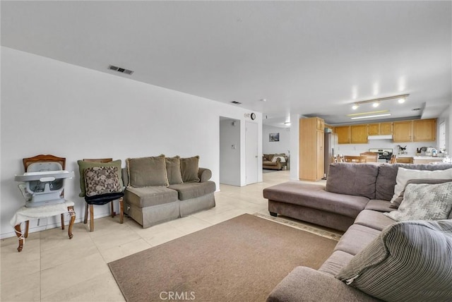 living room with light tile patterned floors