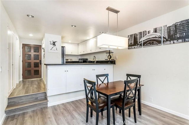 2525 E 19th St Unit 12, Signal Hill, CA 90755 - dining space with baseboards, light wood finished floors, and recessed lighting