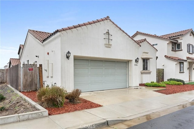 mediterranean / spanish house featuring a garage