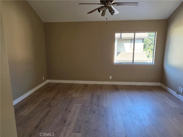 unfurnished room with ceiling fan and hardwood / wood-style floors