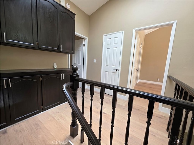 hallway with light hardwood / wood-style flooring