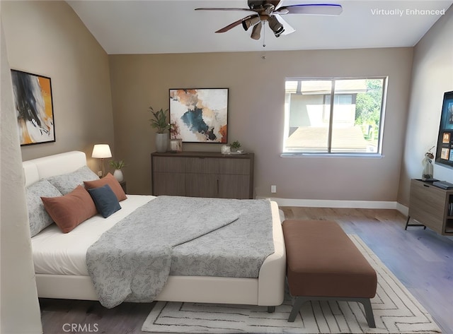 bedroom featuring ceiling fan and hardwood / wood-style floors