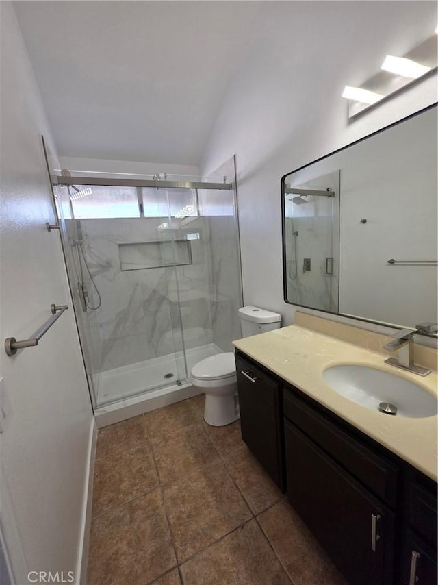 bathroom featuring walk in shower, lofted ceiling, toilet, and vanity