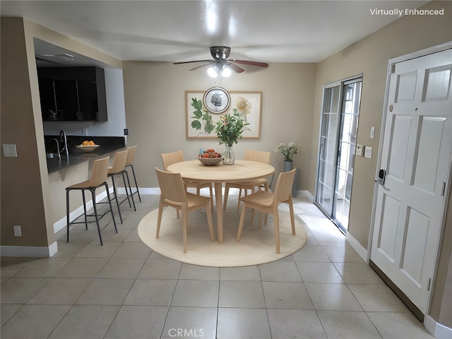 tiled dining room featuring ceiling fan