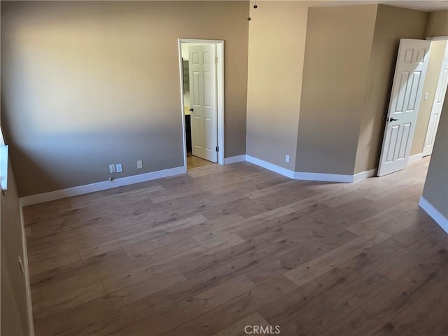 empty room with light hardwood / wood-style floors