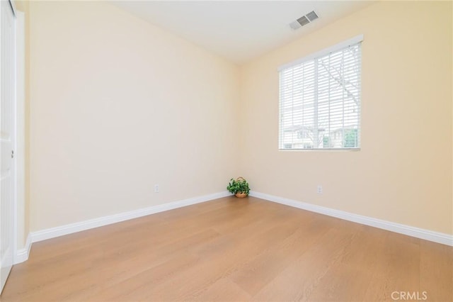 empty room with light hardwood / wood-style floors