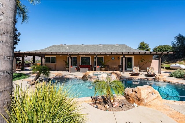 pool with outdoor lounge area and a patio