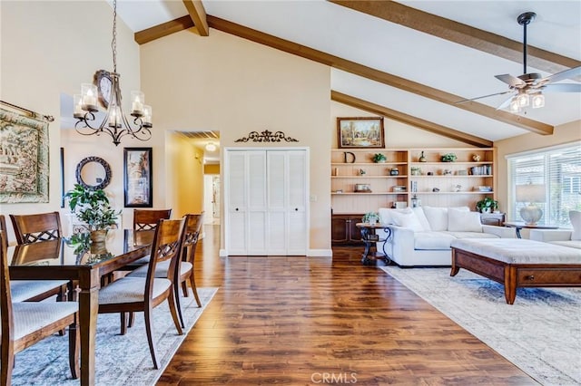 dining room with lofted ceiling with beams, dark wood-style flooring, ceiling fan with notable chandelier, and baseboards