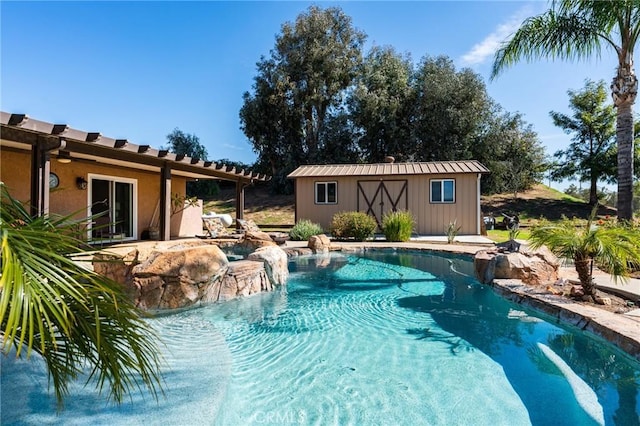 outdoor pool featuring an outbuilding