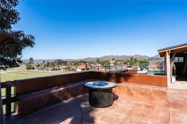 view of patio / terrace featuring a mountain view