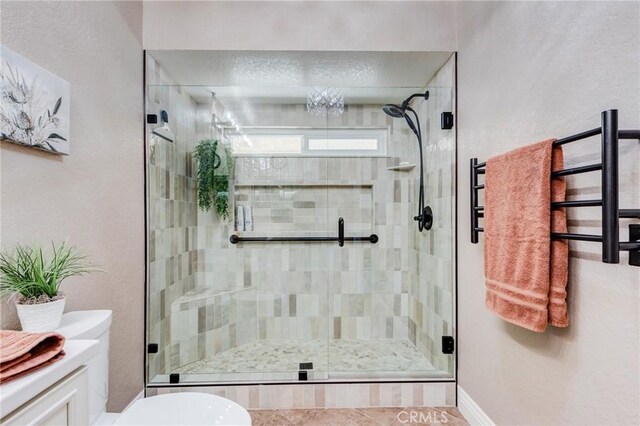 full bathroom featuring toilet and a shower stall