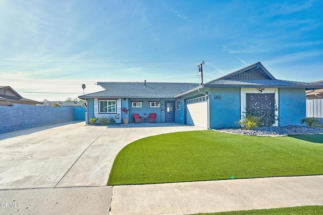 ranch-style house with an attached garage, driveway, fence, and a front yard