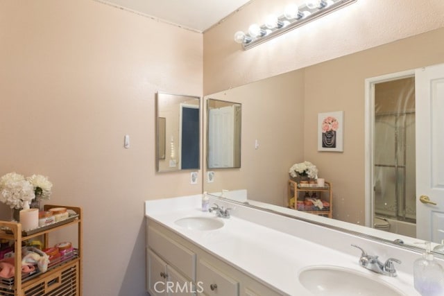 bathroom with vanity and enclosed tub / shower combo