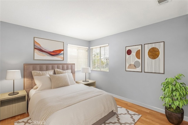 bedroom with light hardwood / wood-style flooring